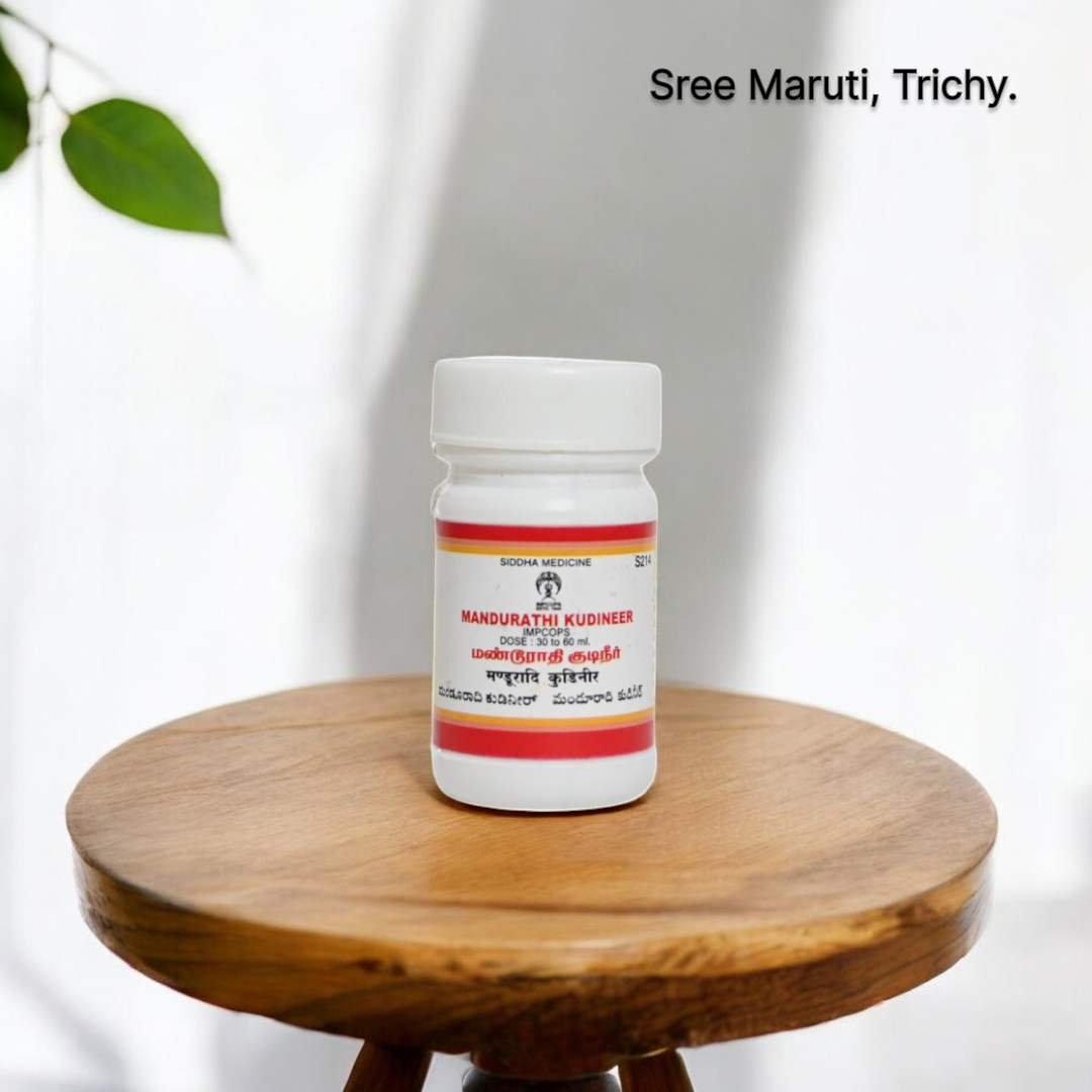 Mandurathi Kudineer in a herbal cup with powdered chooranam – used in Siddha medicine for anemia and detoxification.