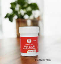 Pain Balm Double Strong jar with herbal ingredients like menthol and eucalyptus – used for headache, nasal congestion, and muscular pain relief.