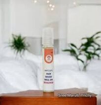 Pain Relief Roll-On bottle with herbal ingredients and a person applying it on the forehead – fast-acting remedy for headache, cold, and muscle pain.