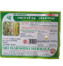 Vasambu powder and dried sweet flag root on white background