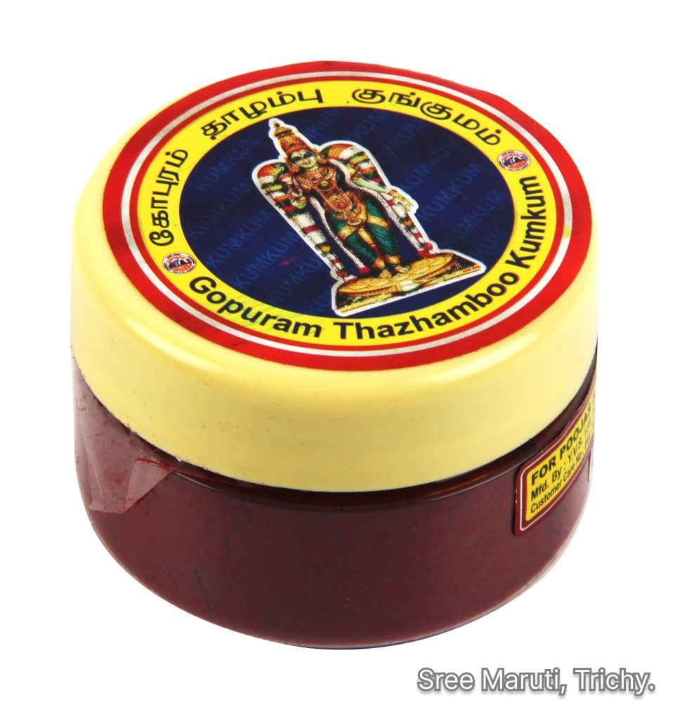Gopuram Thazhamboo Kumkum container with red fragrant kumkum powder and flowers.