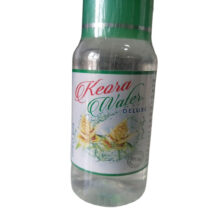 Bottle of Kewra Water with pandanus flowers.