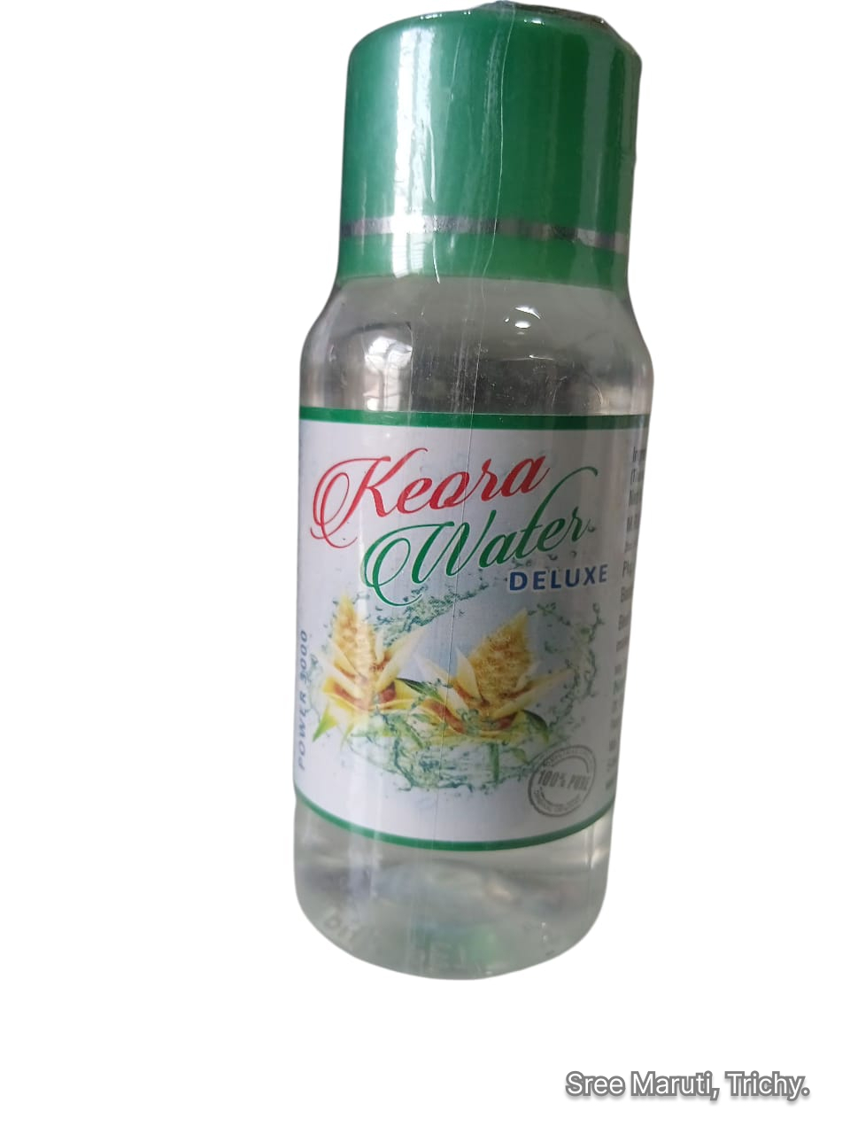 Bottle of Kewra Water with pandanus flowers.