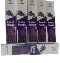Burning lavender incense stick with lavender flowers in the background.
