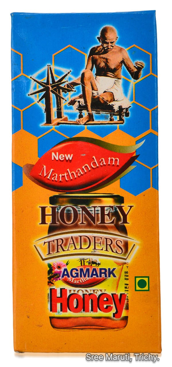 New Marthandam Honey jar with honey dipper and honeycomb.