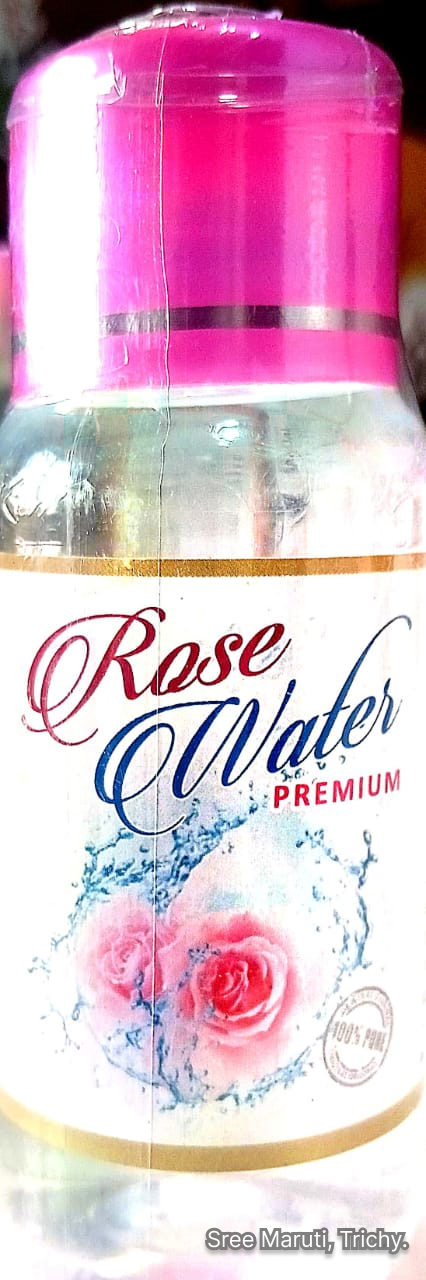 Bottle of Rose Water Premium with rose petals and water bowl.