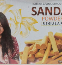 Natural sandalwood powder in a bowl with sandalwood sticks.