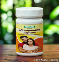 Ashwagandha legiyam in a bowl with Ashwagandha roots and milk for stamina and strength.