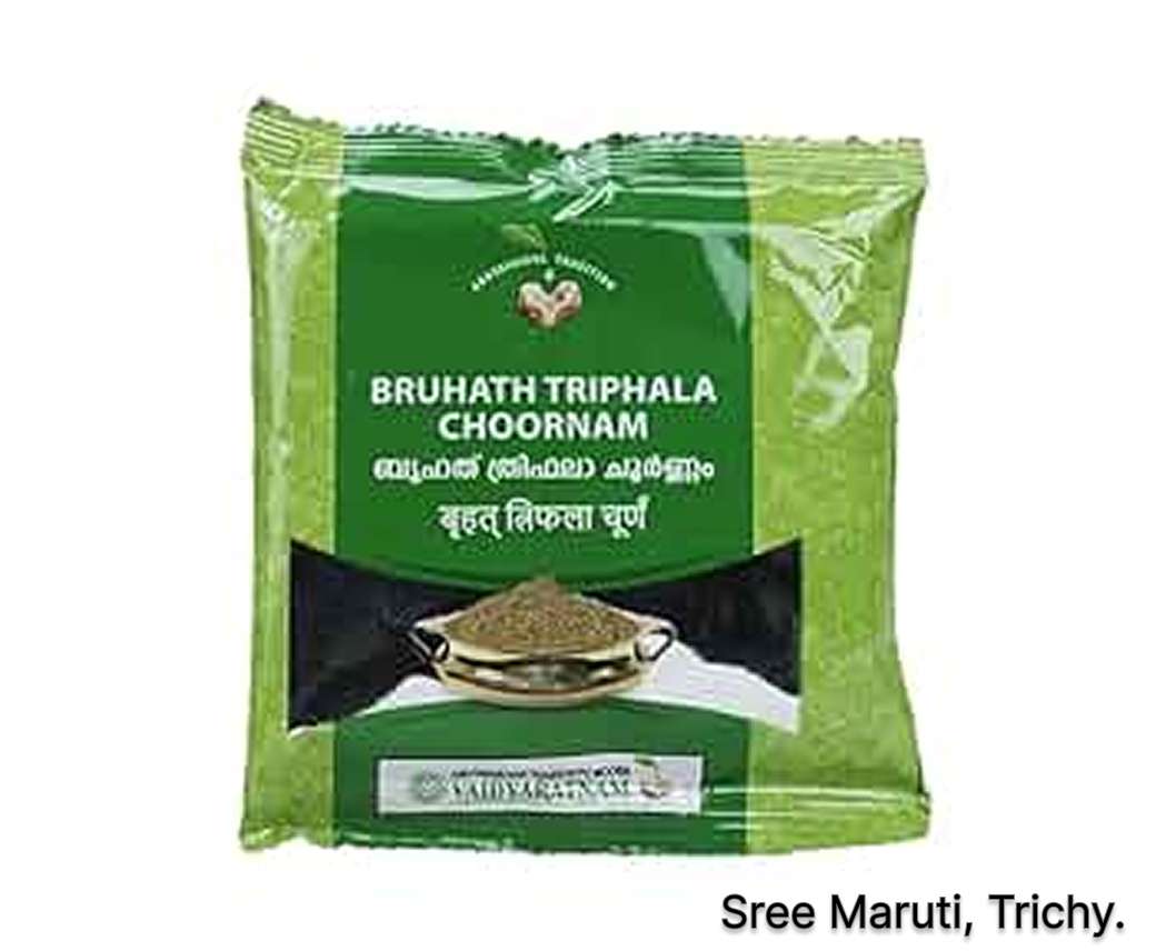 Bruhath Triphala Choornam powder with Haritaki, Vibhitaki, and Amalaki fruits.