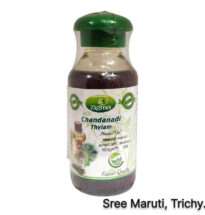 Chandanadhi Thailam bottle with sandalwood and herbs for Ayurvedic head massage
