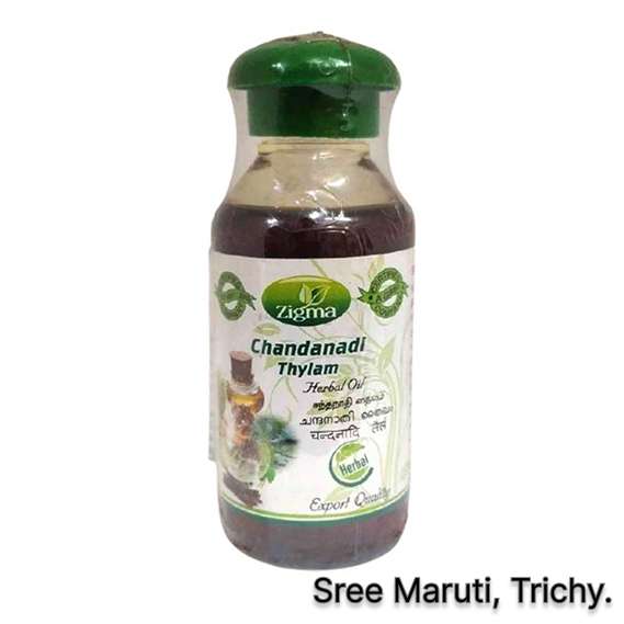 Chandanadhi Thailam bottle with sandalwood and herbs for Ayurvedic head massage