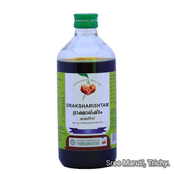 Draksharishtam bottle with grapes and Triphala – Ayurvedic fermented tonic for digestion and energy restoration.