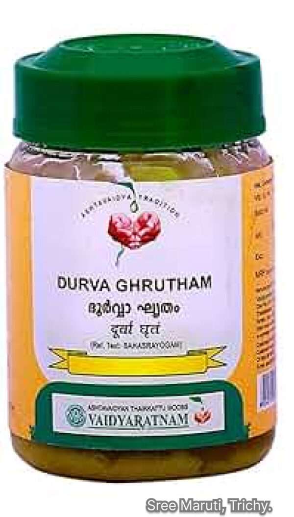 Durva Ghrutham in a jar with Durva grass – herbal ghee for fertility, urinary health, and nervous system support.