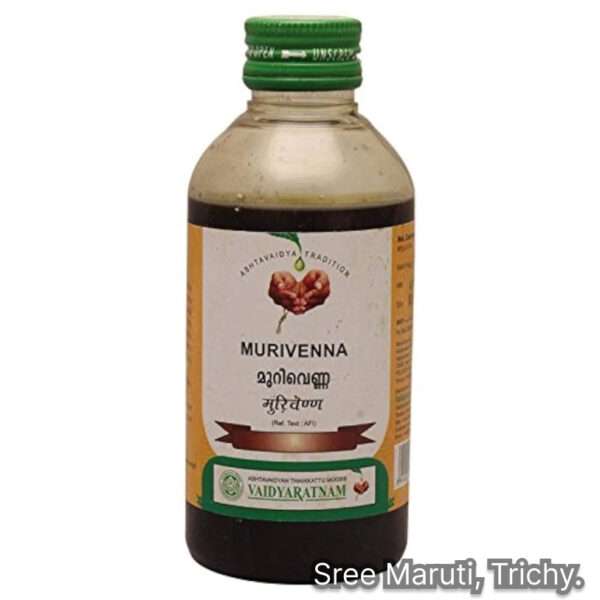 Murivenna oil bottle with betel leaves, drumstick leaves, and coconut.