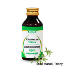 Ponnankanni Thailam herbal oil with fresh Ponnankanni leaves.