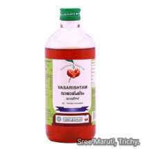 Vasarishtam bottle and Vasa leaves – Ayurvedic remedy for cough, asthma, and bronchitis.