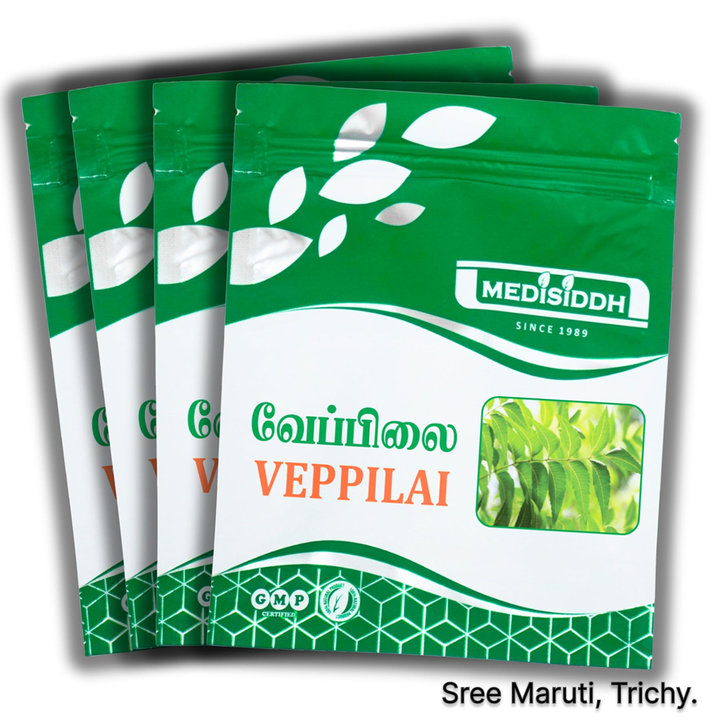 Neem leaf powder (Veppilai Chooranam) in a bowl with neem leaves for immunity and detoxification