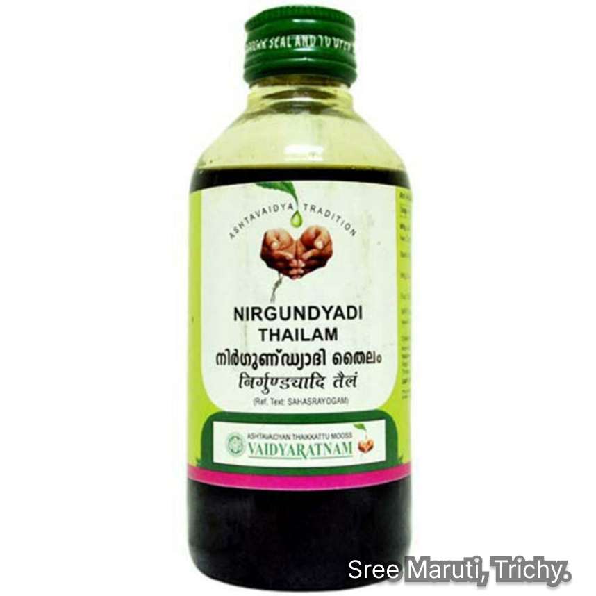 Nirgundyadi Thailam Ayurvedic oil bottle with Nirgundi leaves and herbs for joint and muscle pain relief.