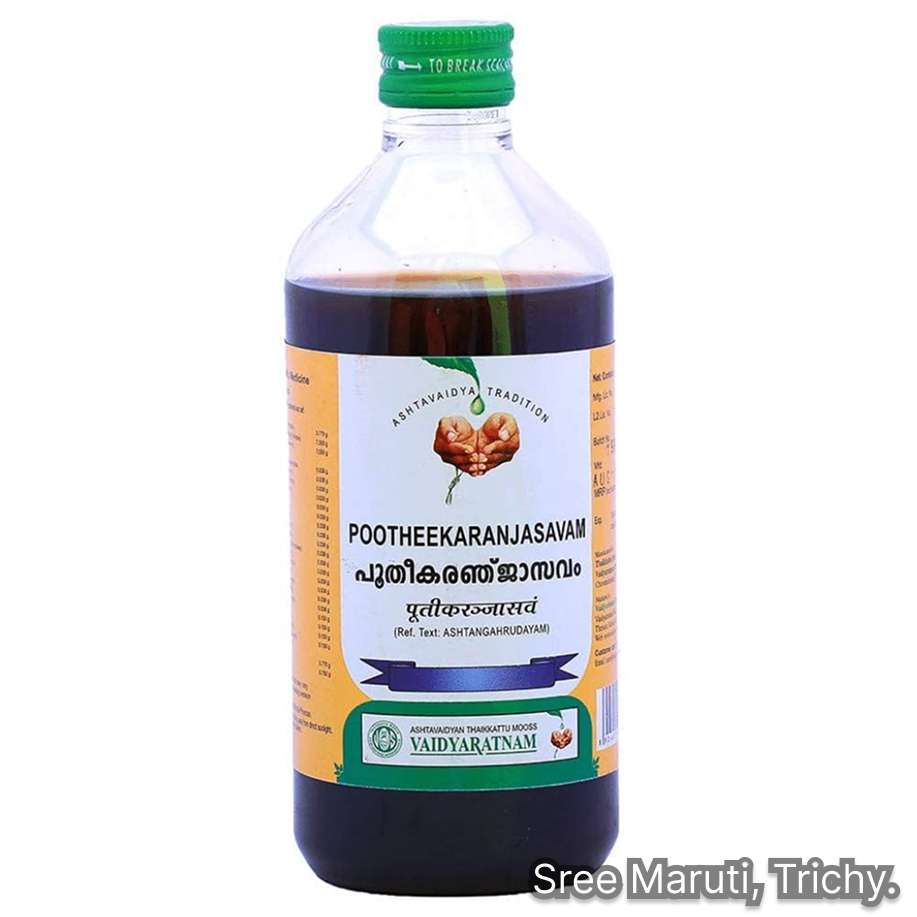 Bottle of Pootheekaranjasavam Ayurvedic tonic with herbs for treating skin diseases and purifying the blood.