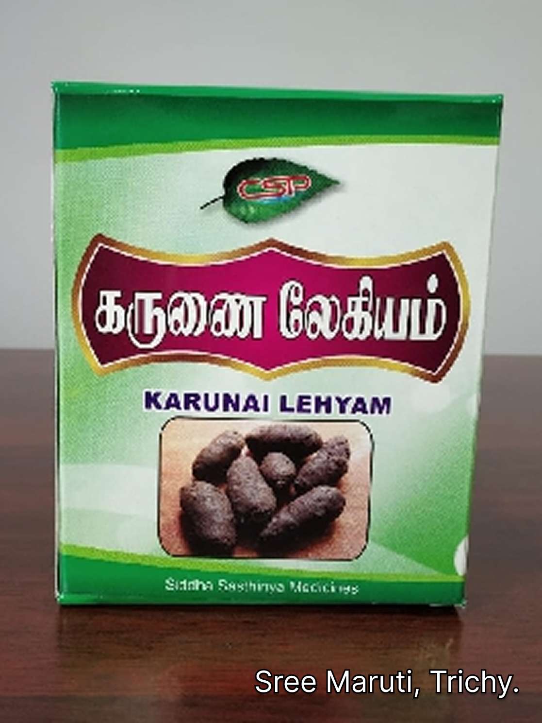 Karunai Lehyam jar with herbal ingredients and Elephant Yam.