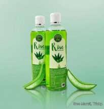 Bottle of Rise Aloevera Shampoo with Aloe Vera leaves representing hydration and hair nourishment