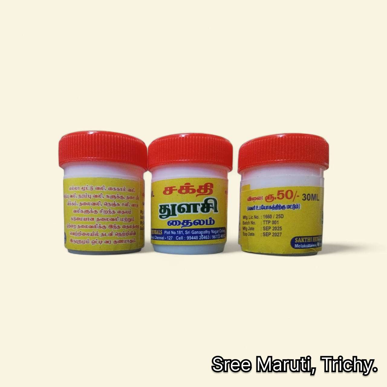 Bottle of Sakthi Thulasi Thailam herbal oil with Tulasi leaves and Ayurvedic herbs
